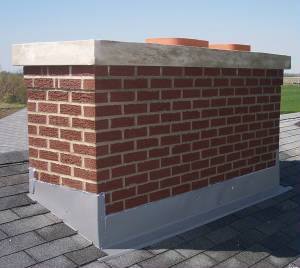 Red brick masonry chimney with concrete chimney crown missing a protective chase cover