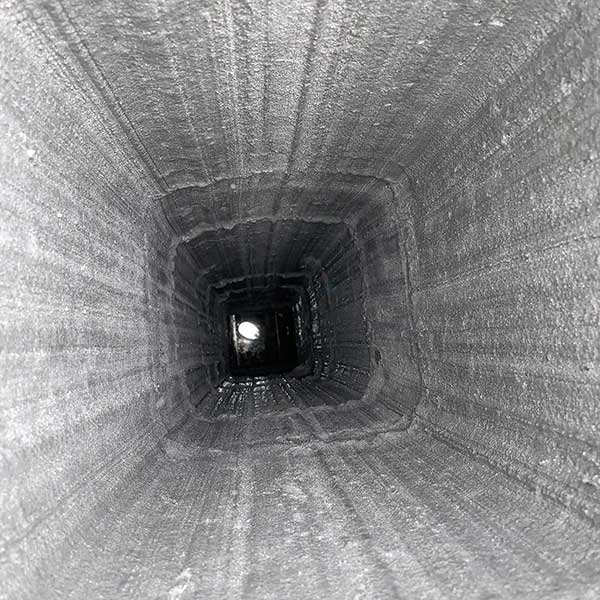 Inside view of chimney flue after relining free of cracks and rust