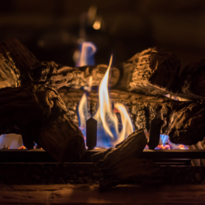 close up of gas logs with flame lit