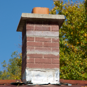 masonry chimney with flashing that needs repairs