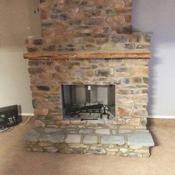 Prefab Chimney Completed with stone surround, hearth and chimney.  